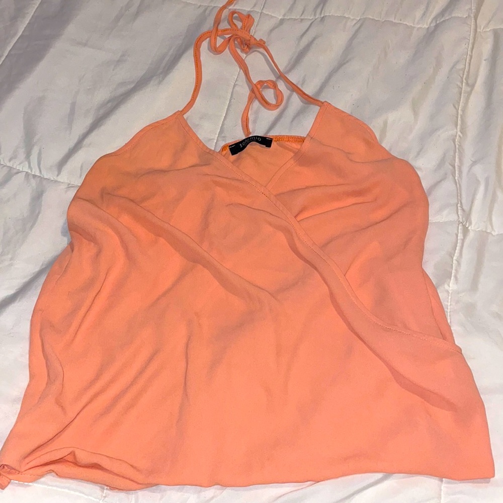 Orange open back tank top.